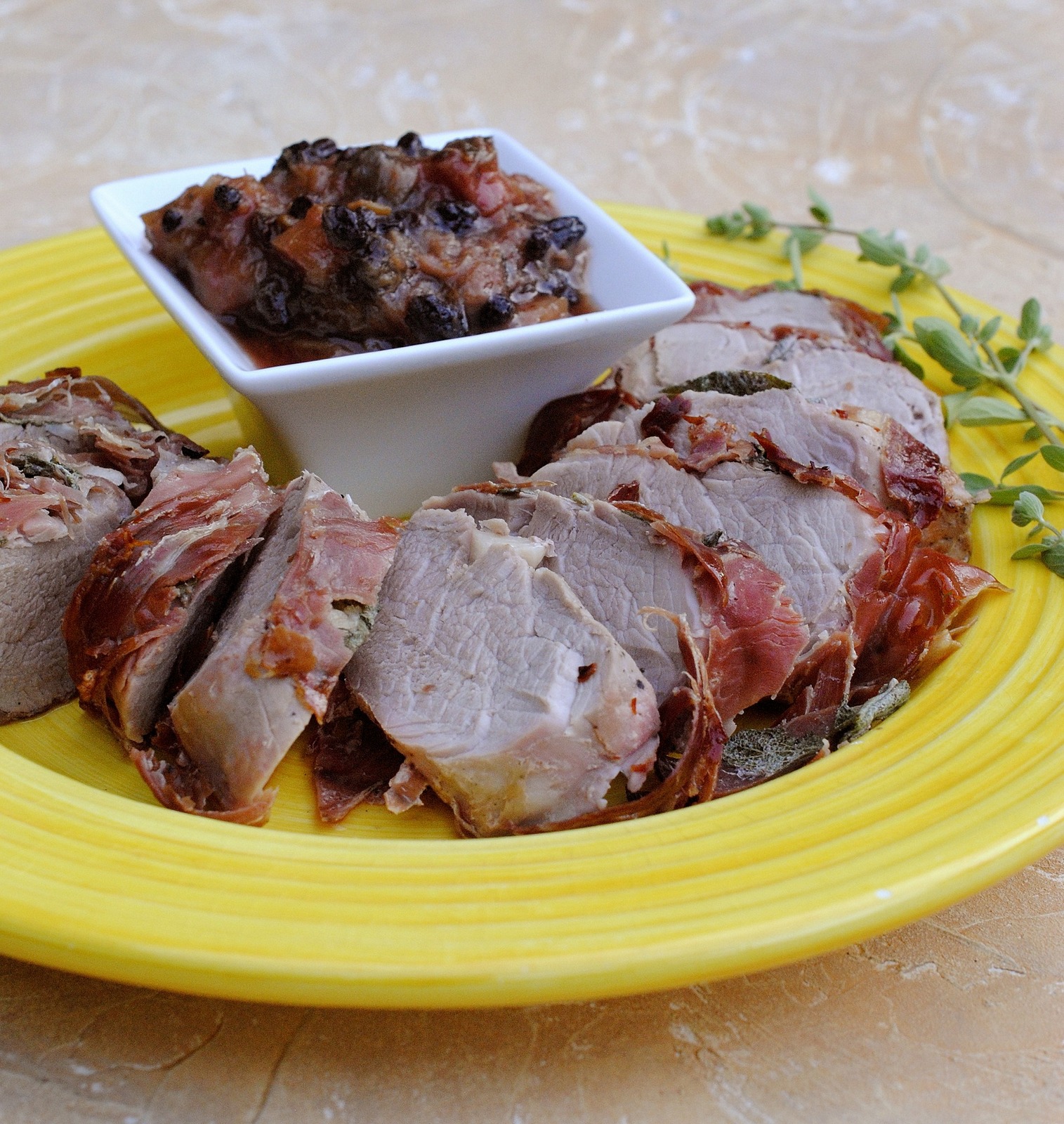 BBQ Pork Tenderloin, Rhubarb Chutney on Yellow Plate