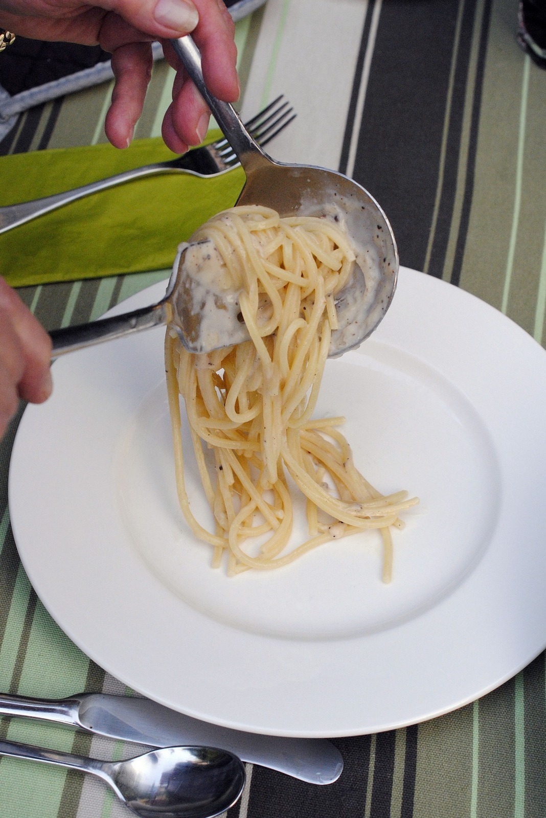 Cacio e Pepe Being Served Outdoors, Green Striped Tablecloth