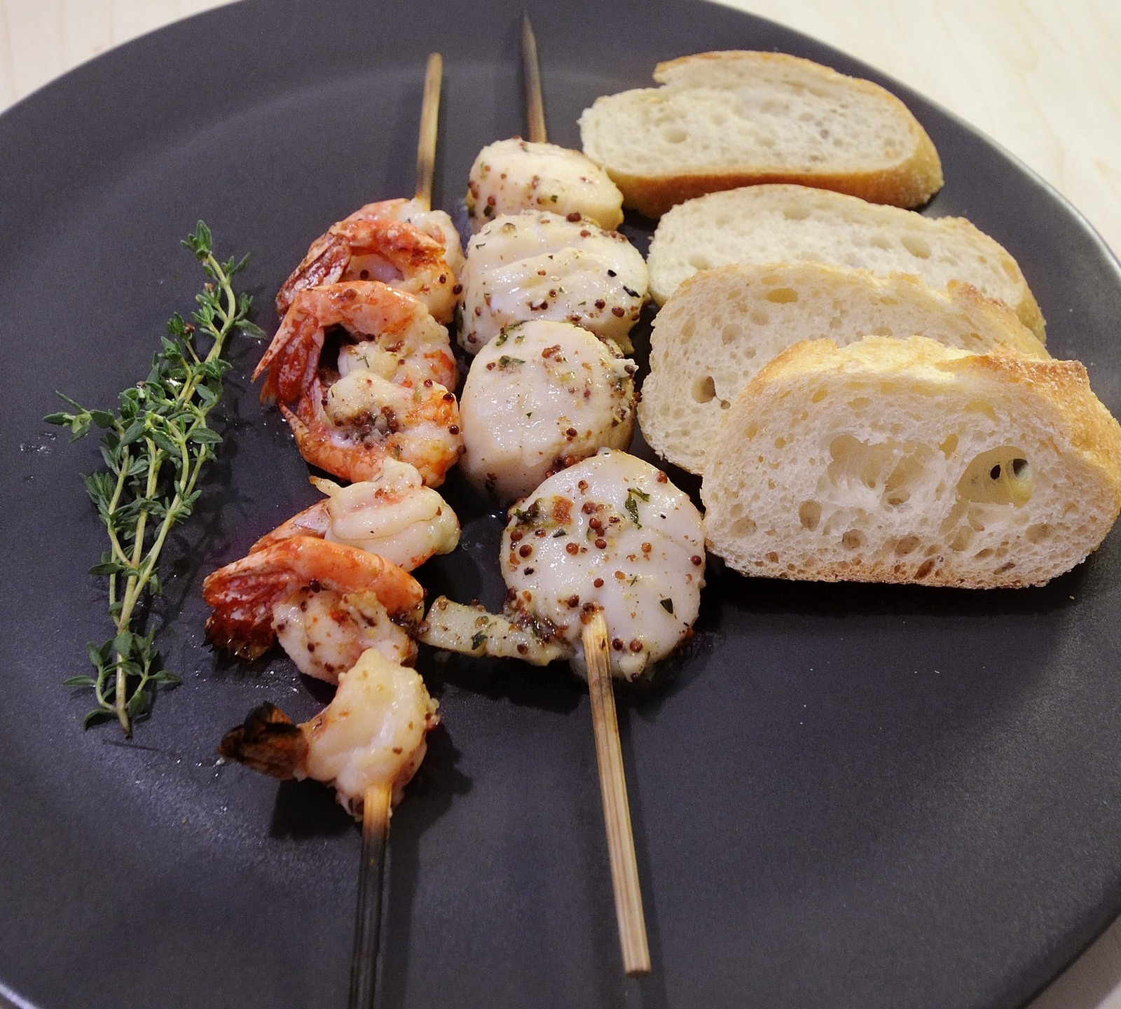Marinade for Seafood or Fish Brochettes, Dark Brown Plate, Baguette Slices