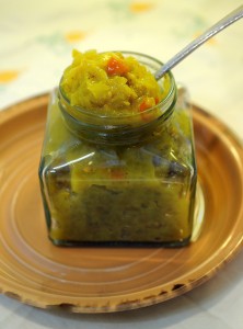 Jar of Mary's Green Tomato Relish Being Spooned Out