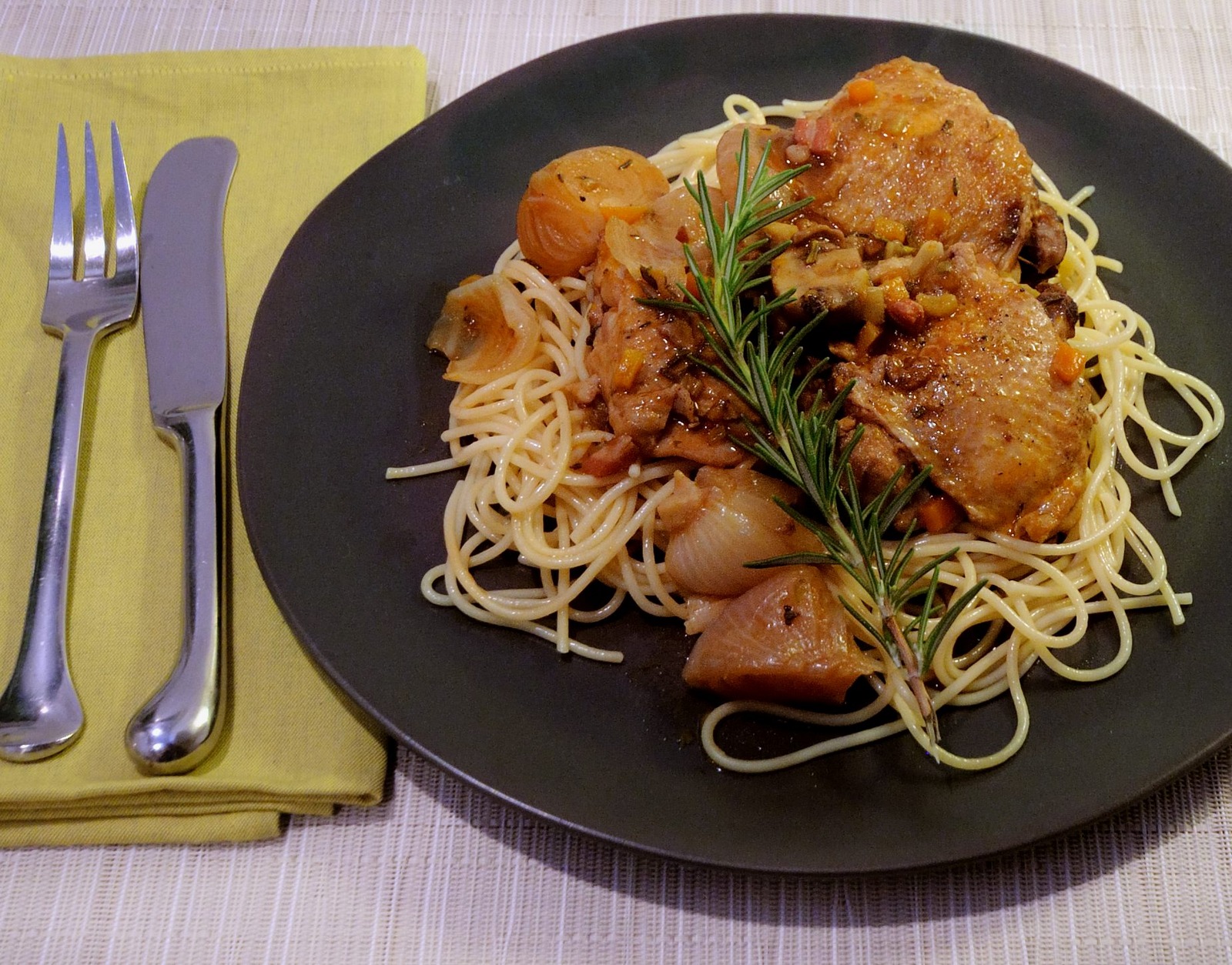 Chicken Thighs & Red Wine Sauce Served Over Spaghetti, Dark Plate