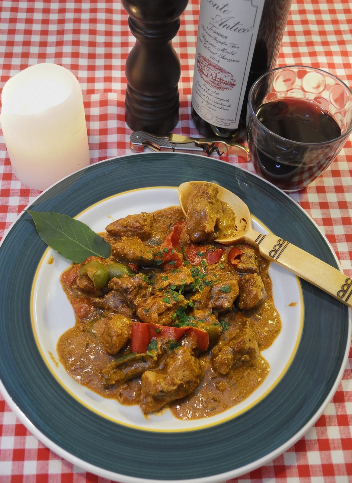 Hungarian Pork Goulash, Wooden Spoon, Red Wine, Red Checked Tablecloth