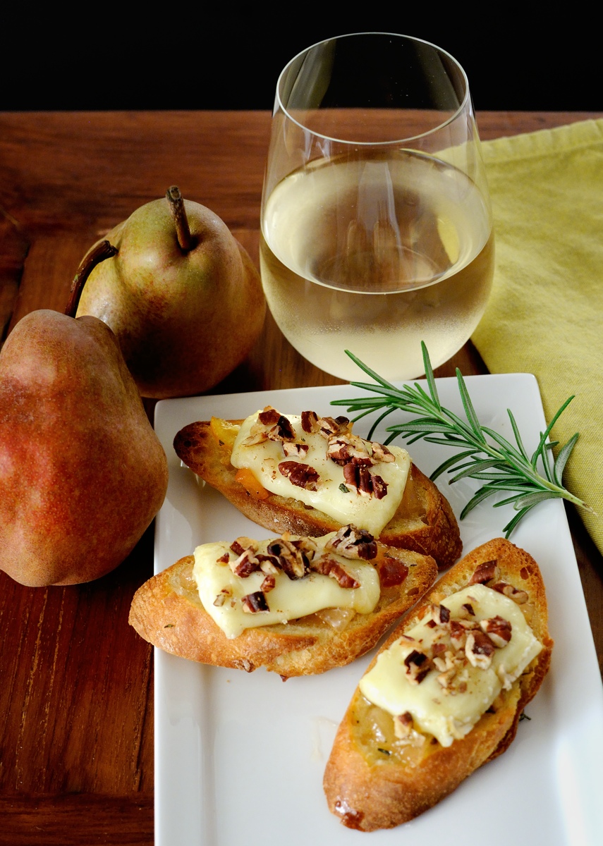 Honey Pear Crostini, Melted Brie, Glass of White Wine