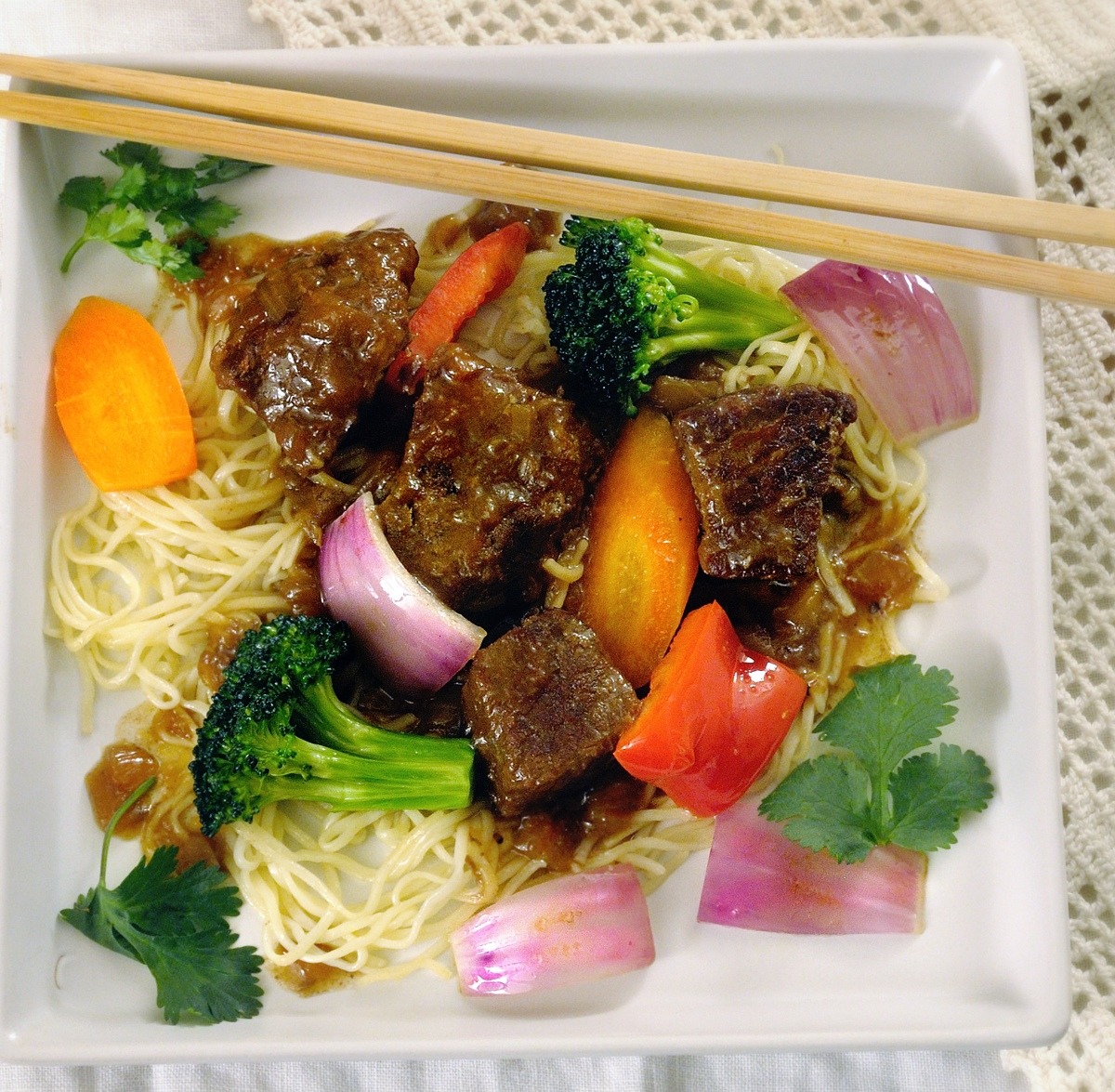 Braised Beef with Star Anise, Chinese Noodles & Stir Fry Vegetables, Square White Plate, Chopsticks