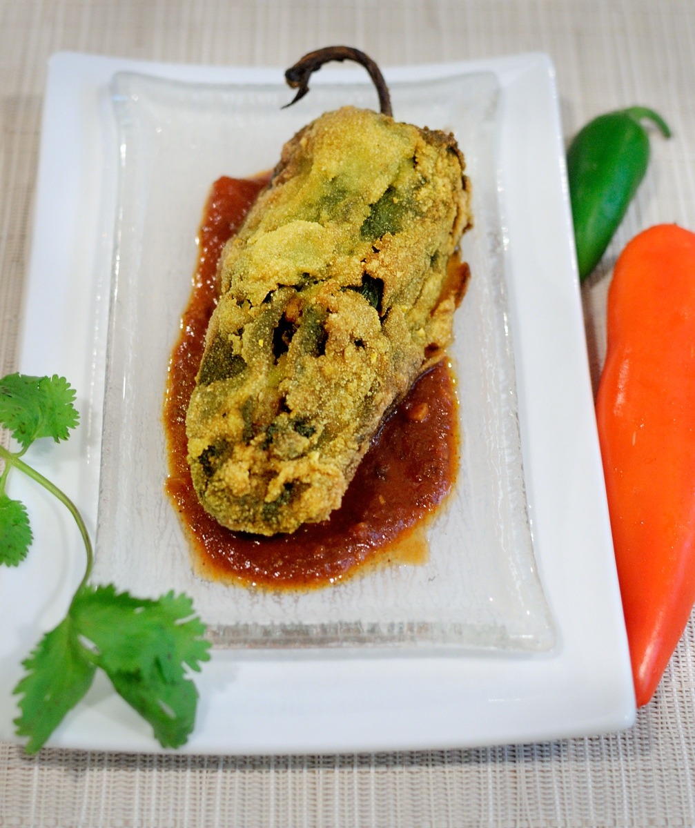 Chiles Rellenos on White & Glass Plate, Red Sauce