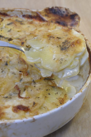 Scalloped Potatoes, Roasted Garlic, Herbs, Round White Baking Dish. Used Also for Potato and Turnip Gratin